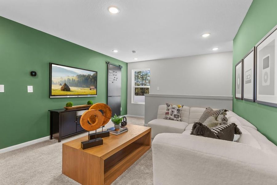 A living room with a couch and a tv. A living room with a couch and a tv.