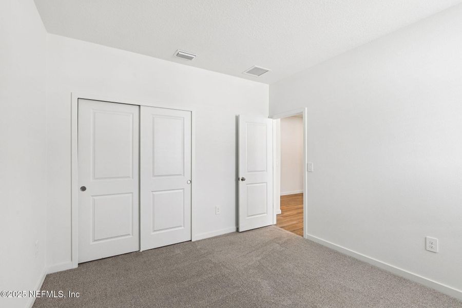 Spacious, unfurnished interior of a new home in Lakes at Bella Lago - Signature Series, Green Cove Springs (Image 24).