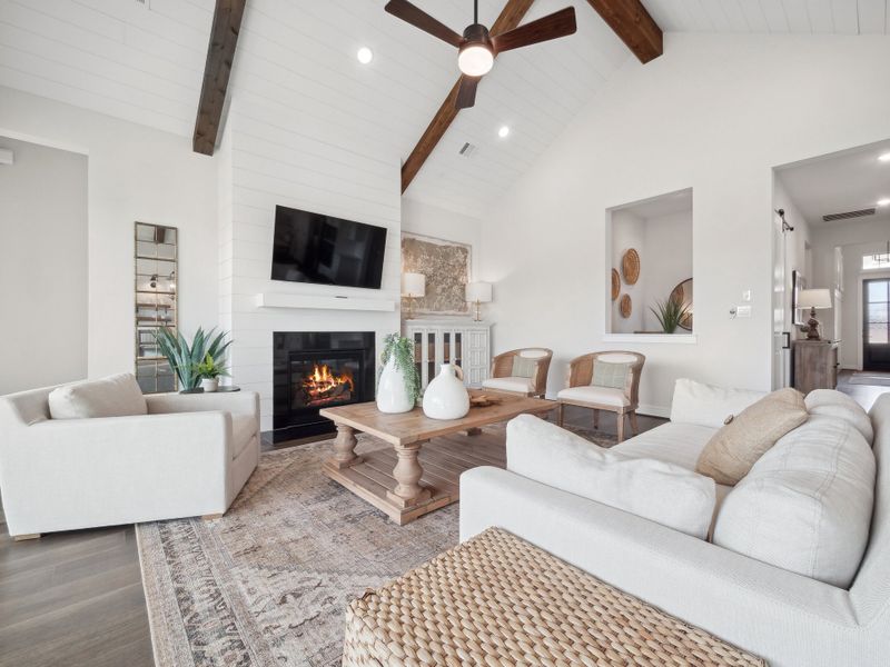 Great room with vaulted ceiling and fireplace