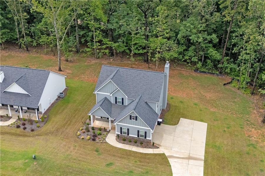 Front exterior of a new home in Benson Estates, Dallas, GA, highlighting curb appeal (Image 26). Front exterior of a new home in Benson Estates, Dallas, GA, highlighting curb appeal (Image 26).
