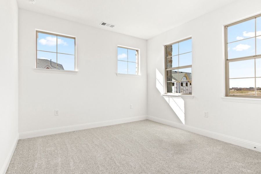 Spacious, unfurnished interior of a new home in The Tribute, The Colony (Image 35).