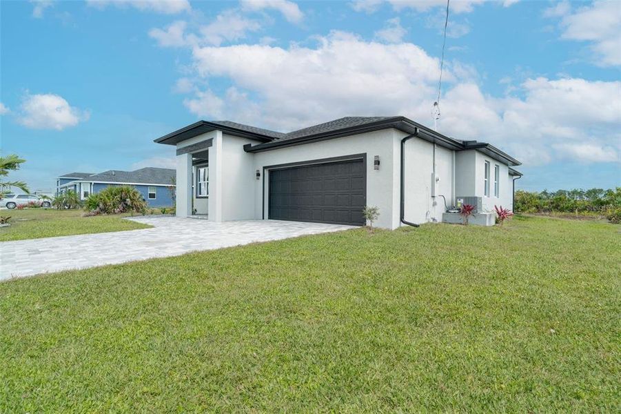 Front exterior of a new home in , Rotonda West, FL, highlighting curb appeal (Image 29).