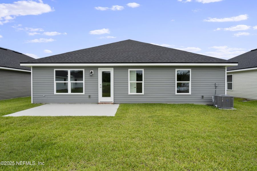 Front exterior of a new home in Summerglen, Jacksonville, FL, highlighting curb appeal (Image 12). Front exterior of a new home in Summerglen, Jacksonville, FL, highlighting curb appeal (Image 12).