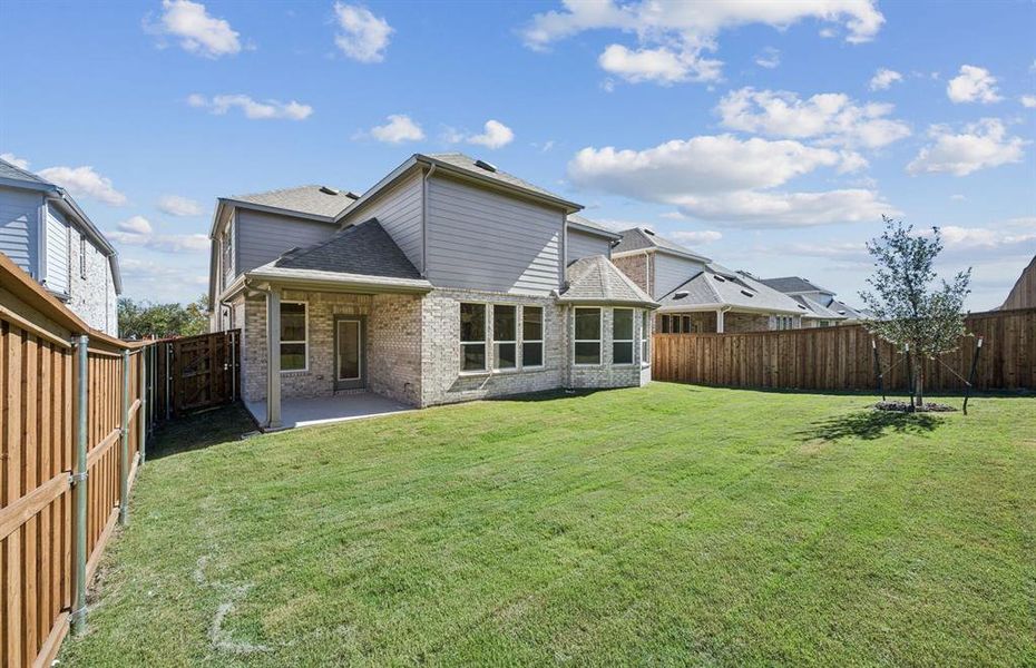 Covered patio offers ample space for entertaining or relaxing Covered patio offers ample space for entertaining or relaxing