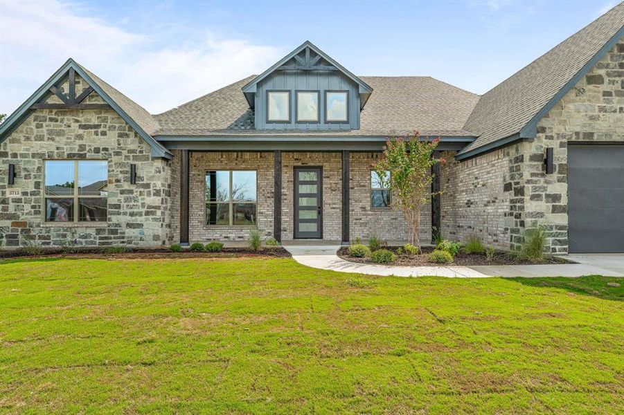 Front exterior of a new home in Pecan Plantation, Granbury, TX, highlighting curb appeal (Image 26).