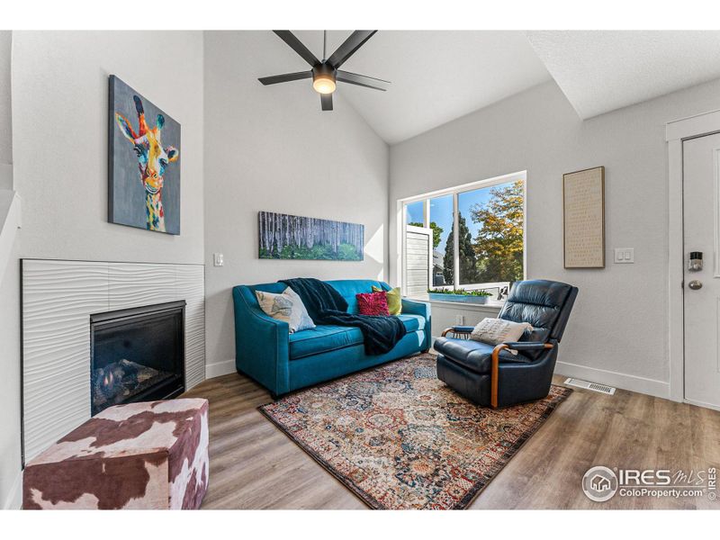 Soaring ceilings and a skylight make for an airy and spacious living room.