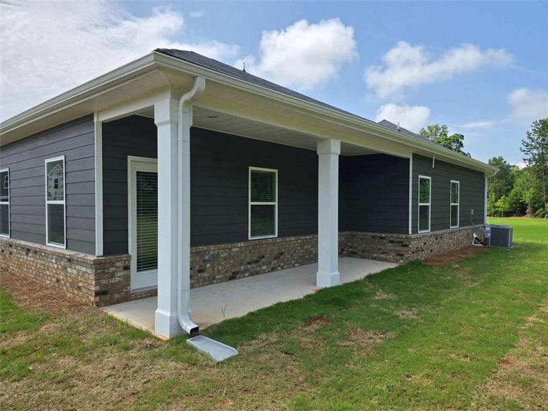 Front exterior of a new home in Southern Hills, McDonough, GA, highlighting curb appeal (Image 1).
