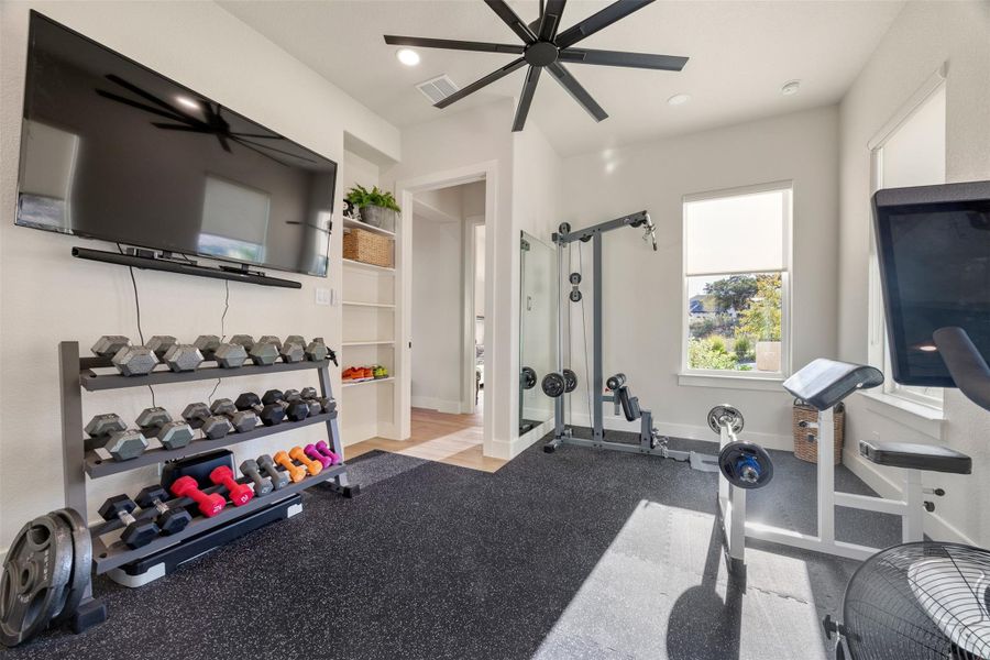 Exercise room featuring ceiling fan Exercise room featuring ceiling fan