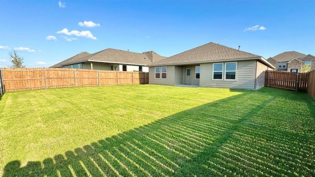 Front exterior of a new home in Rock Creek Ranch, Fort Worth, TX, highlighting curb appeal (Image 1).