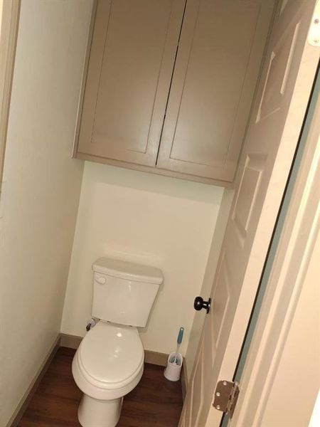 Bathroom with wood finished floors and baseboards Bathroom with wood finished floors and baseboards