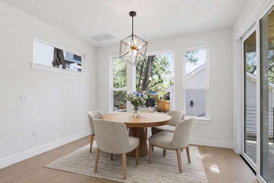 Dining area virtually staged.