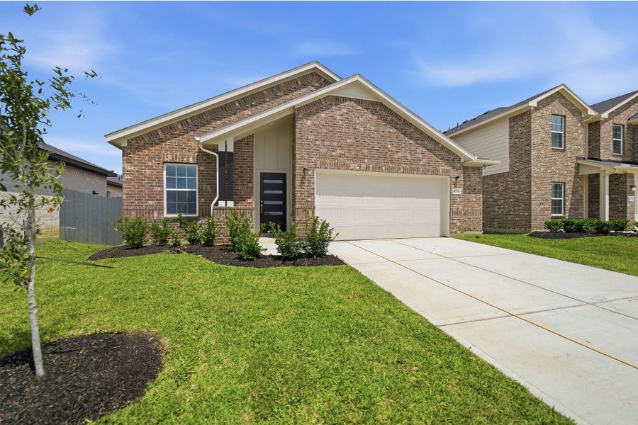 Front exterior of a new home in Bay Creek, Baytown, TX, highlighting curb appeal (Image 2).