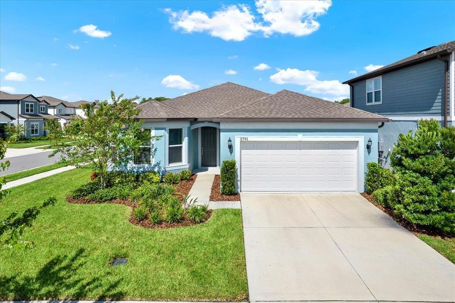 Front exterior of a new home in , Land O' Lakes, FL, highlighting curb appeal (Image 23).