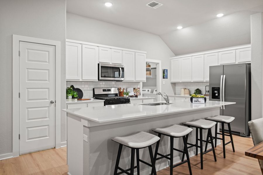 Kitchen in a Trinity Ranch Diamond Model in Elgin TX by Trophy Signature Homes