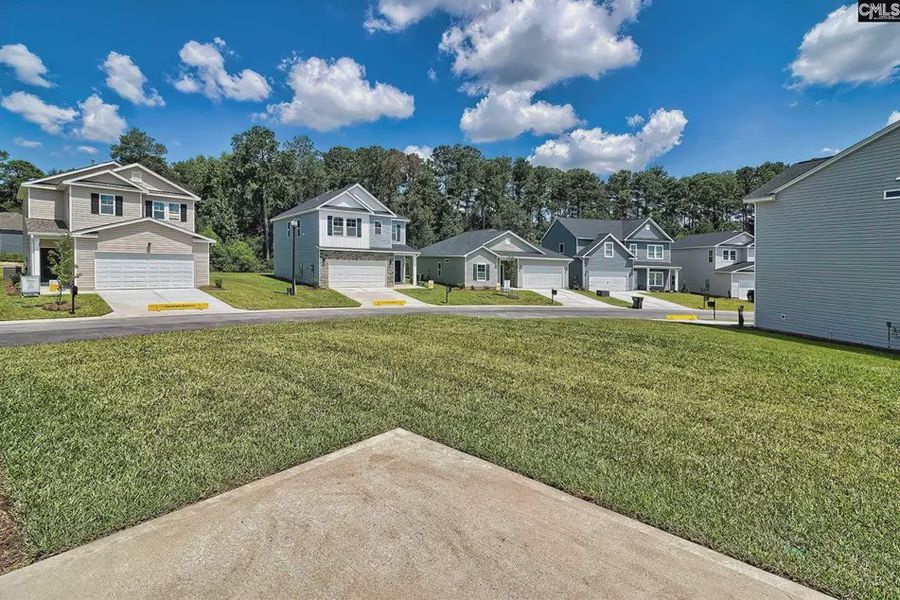 Front exterior of a new home in Emanuel Creek, West Columbia, SC, highlighting curb appeal (Image 30). Front exterior of a new home in Emanuel Creek, West Columbia, SC, highlighting curb appeal (Image 30).