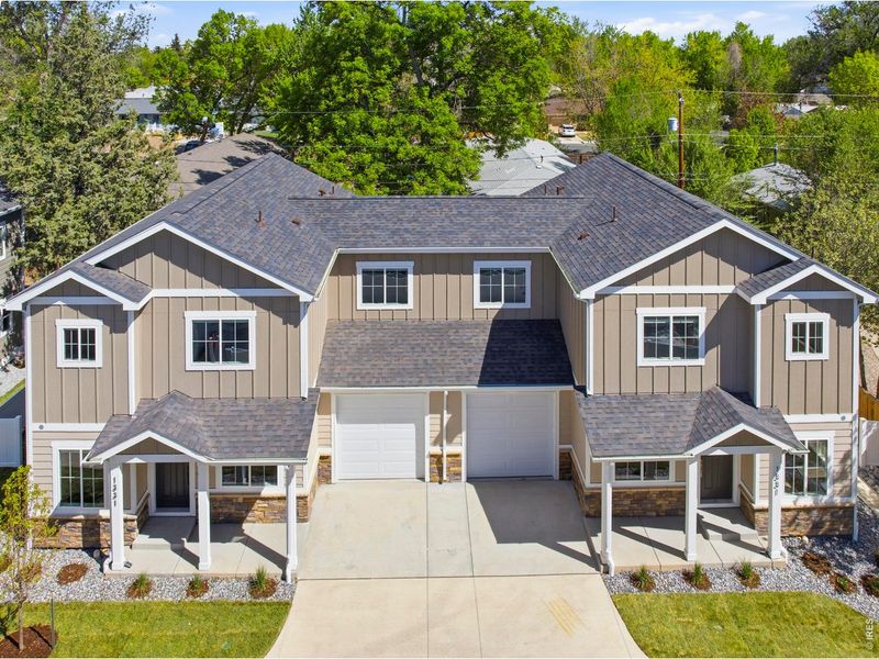 Front exterior of a new home in , Loveland, CO, highlighting curb appeal (Image 27).