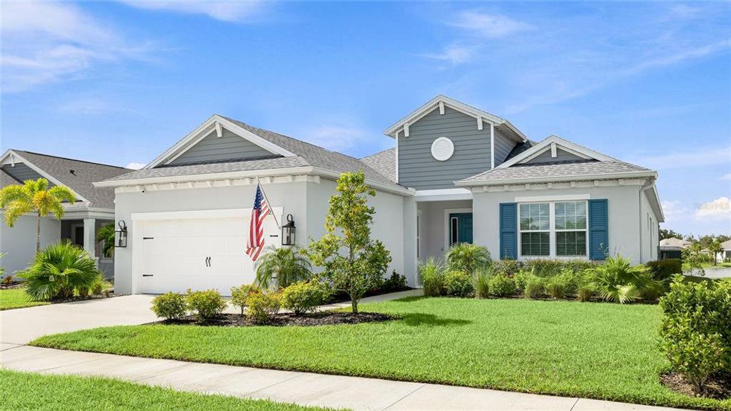 Front exterior of a new home in , Parrish, FL, highlighting curb appeal (Image 20).