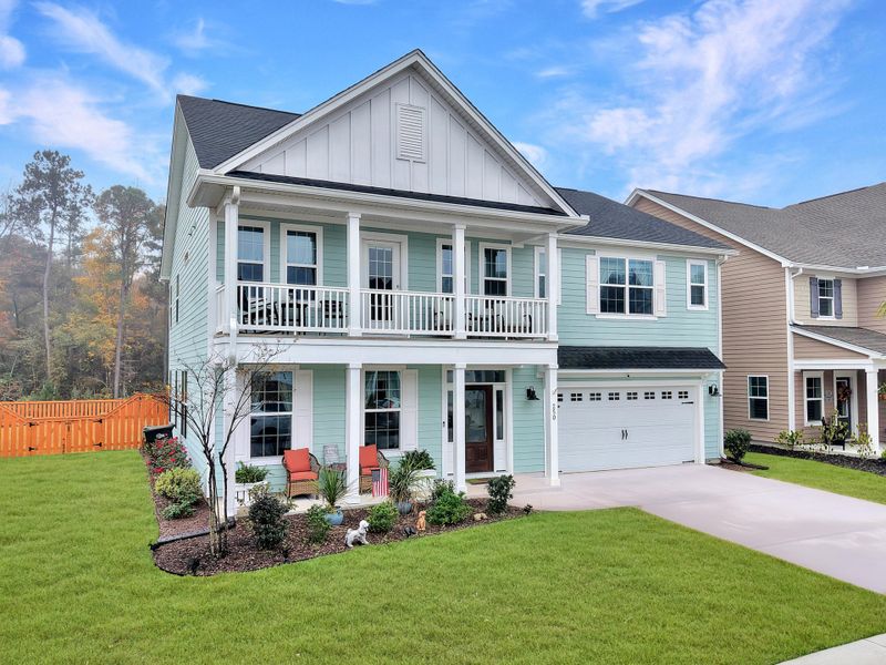 Front exterior of a new home in Hewing Farms, Summerville, SC, highlighting curb appeal (Image 1). Front exterior of a new home in Hewing Farms, Summerville, SC, highlighting curb appeal (Image 1).