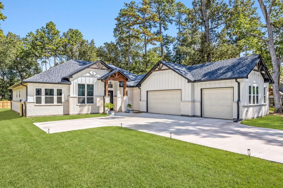 Striking modern ranch 2025 one- story three- car garage home in New Caney.