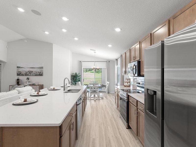 Your new kitchen includes quartz counters, Samsung SS appliances, and a walk-in pantry. Photos showcase a home with similar finishes, not the actual home for sale.