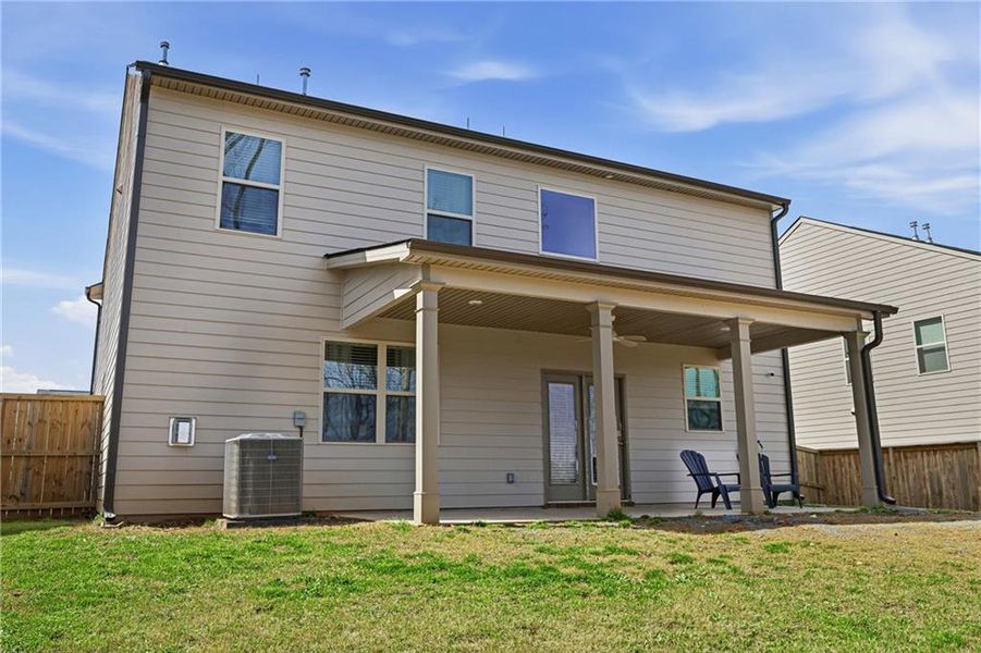 Exterior details and patio area of a home in The Enclave at Flat Rock Hills, Stonecrest (Image 4).