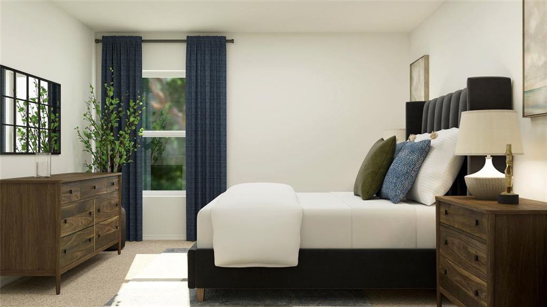 Bedroom featuring light colored carpet