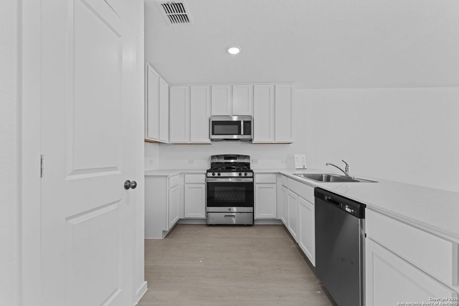 Furnished interior view inside a new home in Torian Village: Belmar Collection, San Antonio (Image 5).
