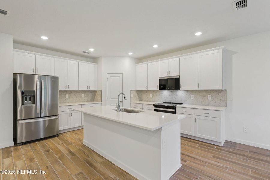 Furnished interior view inside a new home in Colbert Landings, Palm Coast (Image 3).