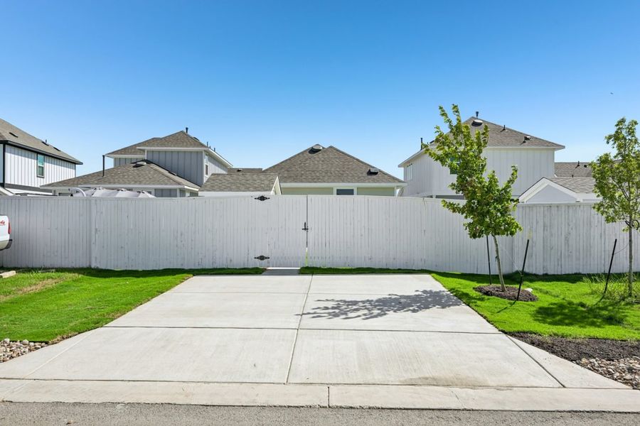Front exterior of a new home in Harvest Ridge, Elgin, TX, highlighting curb appeal (Image 14). Front exterior of a new home in Harvest Ridge, Elgin, TX, highlighting curb appeal (Image 14).