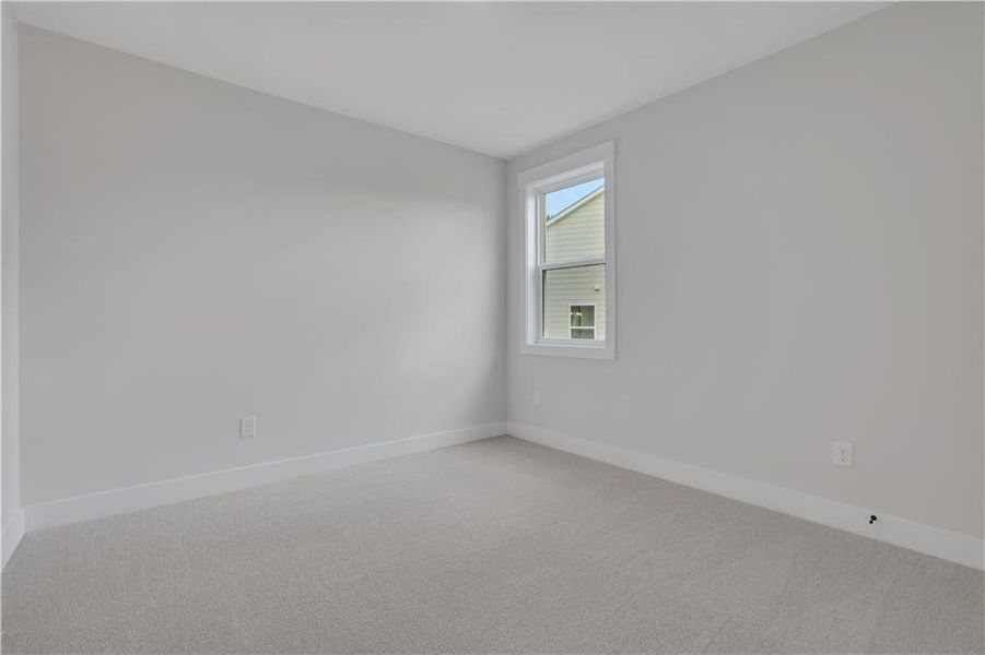 Spacious, unfurnished interior of a new home in The Paddocks at Doc Hughes, Buford (Image 24).