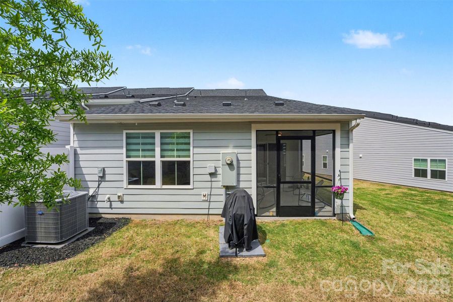 Exterior details and patio area of a home in Smith Village Townhomes, Troutman (Image 21).