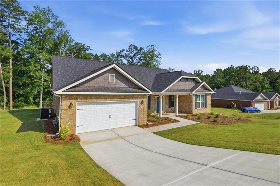 Front exterior of a new home in Tuscany Hills, Douglasville, GA, highlighting curb appeal (Image 21). Front exterior of a new home in Tuscany Hills, Douglasville, GA, highlighting curb appeal (Image 21).