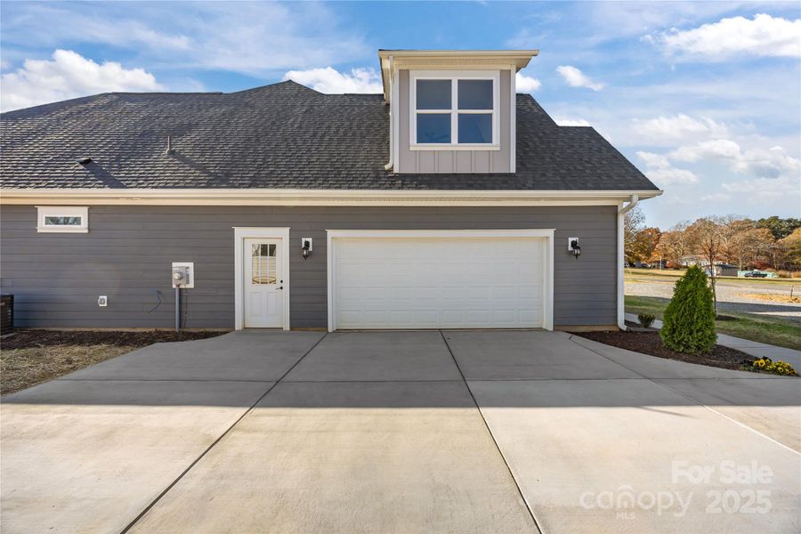 Front exterior of a new home in , Locust, NC, highlighting curb appeal (Image 24).