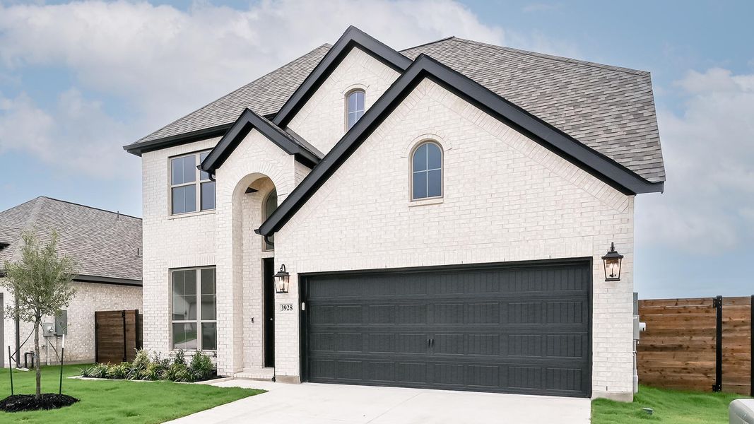 Front exterior of a new home in Juniper Springs, Lockhart, TX, highlighting curb appeal (Image 1). Front exterior of a new home in Juniper Springs, Lockhart, TX, highlighting curb appeal (Image 1).