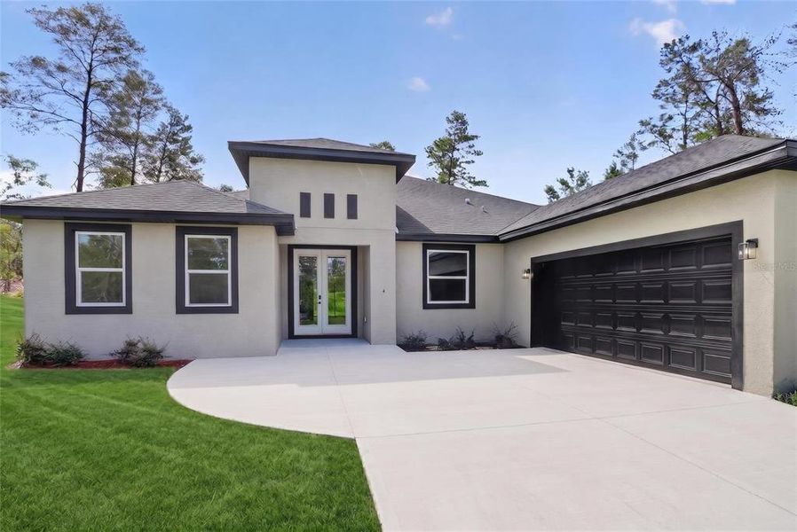 Front exterior of a new home in , Homosassa, FL, highlighting curb appeal (Image 2). Front exterior of a new home in , Homosassa, FL, highlighting curb appeal (Image 2).