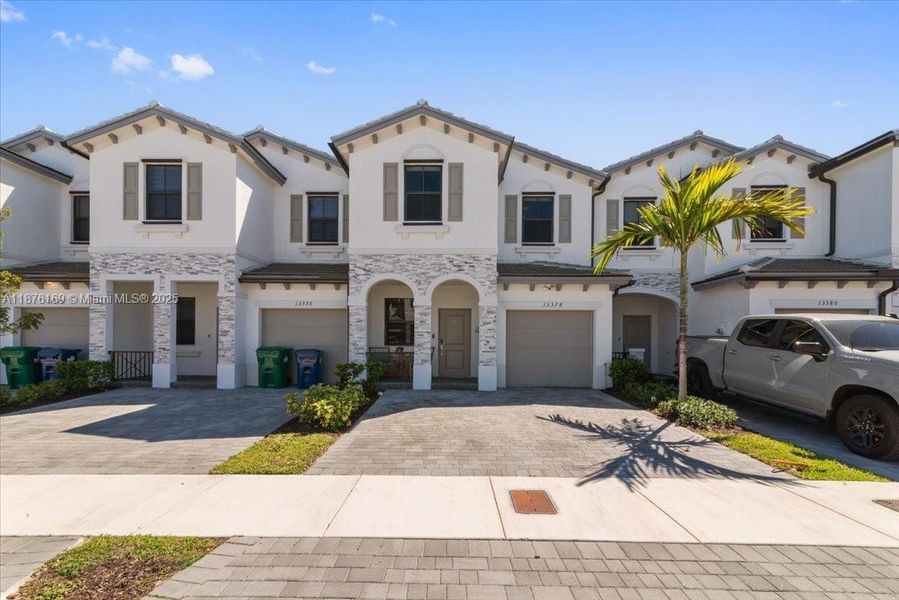 Front exterior of a new home in , Homestead, FL, highlighting curb appeal (Image 19).