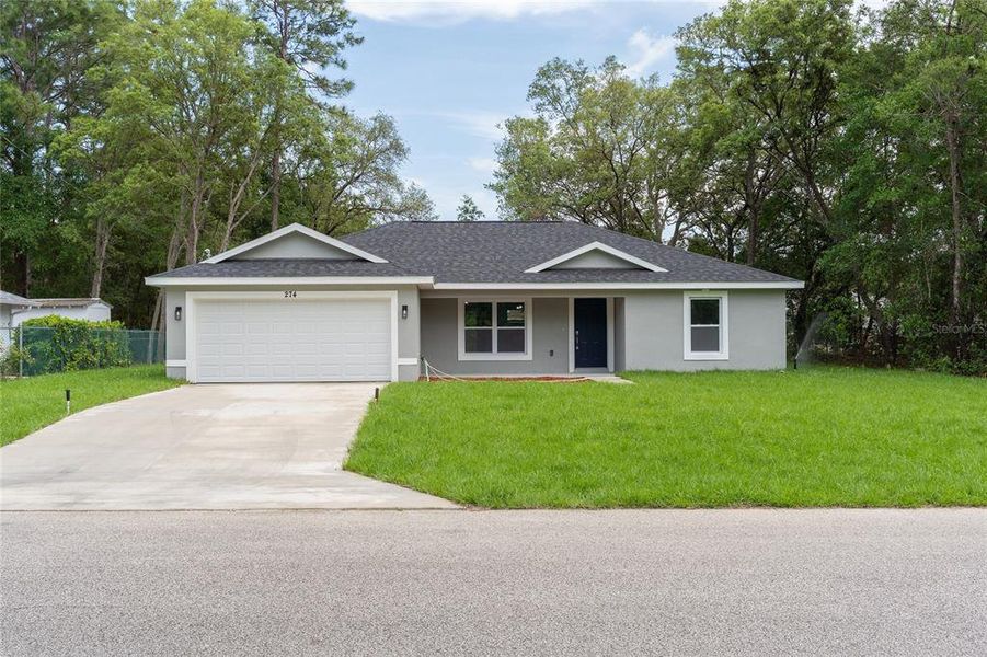 Front exterior of a new home in , Citrus Springs, FL, highlighting curb appeal (Image 18).