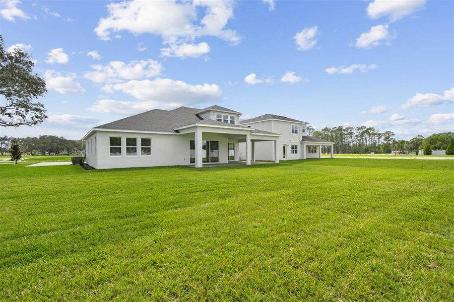 Exterior details and patio area of a home in Solace at Corner Lake, Orlando (Image 31).