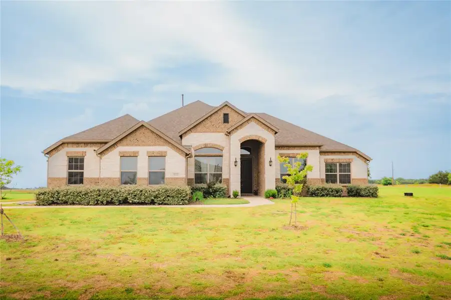Front exterior of a new home in Creekview Farms, Greenville, TX, highlighting curb appeal (Image 1). Front exterior of a new home in Creekview Farms, Greenville, TX, highlighting curb appeal (Image 1).