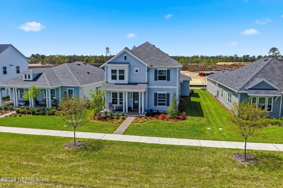 Front exterior of a new home in Seven Pines 50' Rear Entry, Jacksonville, FL, highlighting curb appeal (Image 24).