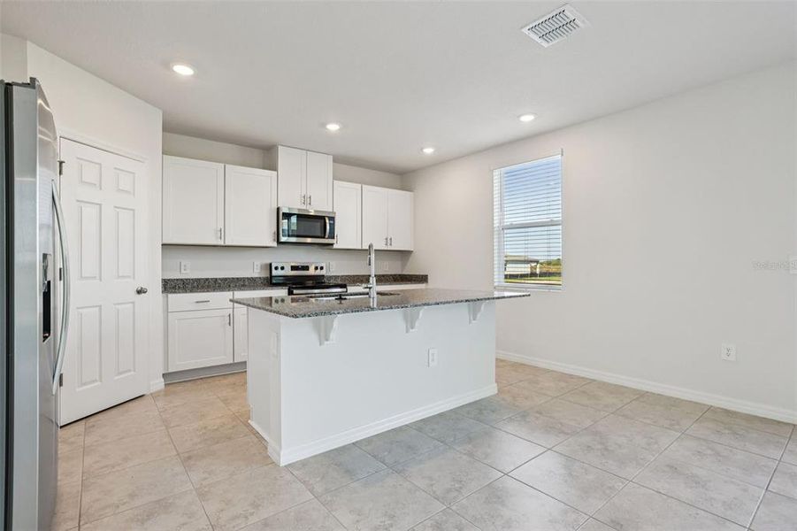 Furnished interior view inside a new home in Lake Deer Estates - Signature Series, Poinciana (Image 9).