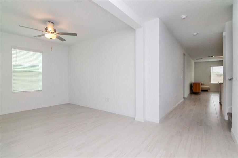 Flex Room and Foyer leading to Open Concept  Kitchen, Dining and Living Area with beautiful backyard views