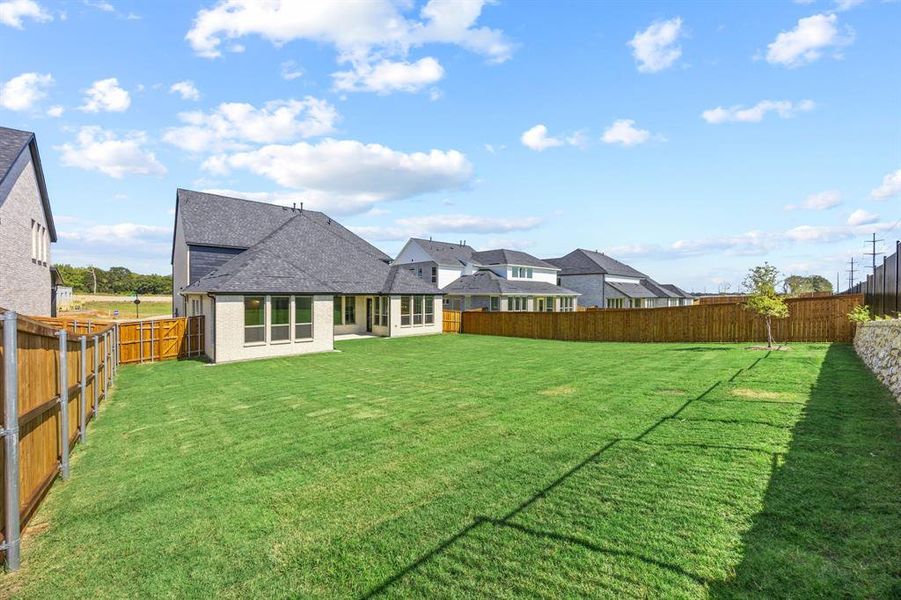 Exterior details and patio area of a home in Chatham Reserve, Providence Village (Image 3).