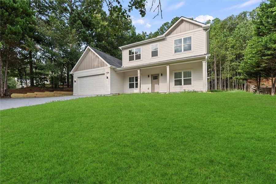 Front exterior of a new home in , Dacula, GA, highlighting curb appeal (Image 1). Front exterior of a new home in , Dacula, GA, highlighting curb appeal (Image 1).
