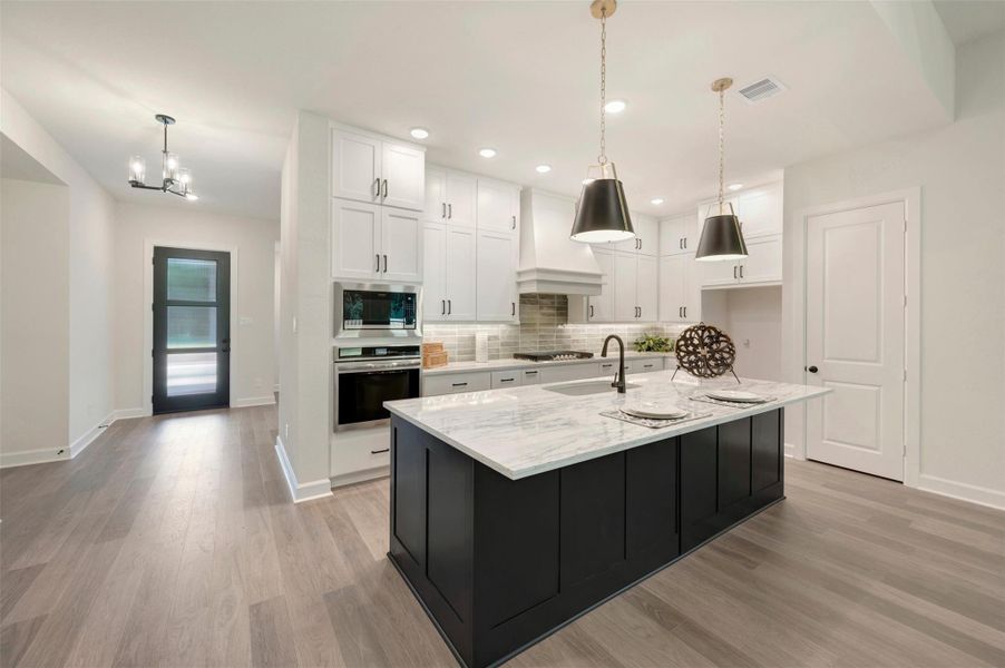Imagine cooking in this gorgeous Kitchen with ceiling height cabinetry, quartz counters and 5-burner gas cooktop w/updraft vent hood!