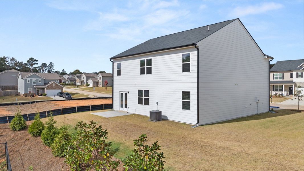 Front exterior of a new home in Locust Grove Station - Cedar Ridge, Locust Grove, GA, highlighting curb appeal (Image 21).