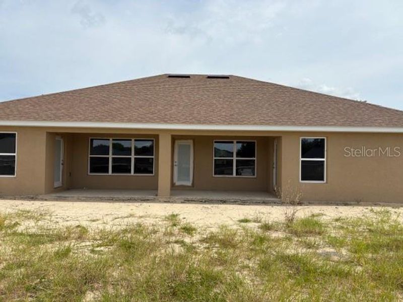 Front exterior of a new home in Juliette Falls, Dunnellon, FL, highlighting curb appeal (Image 8).