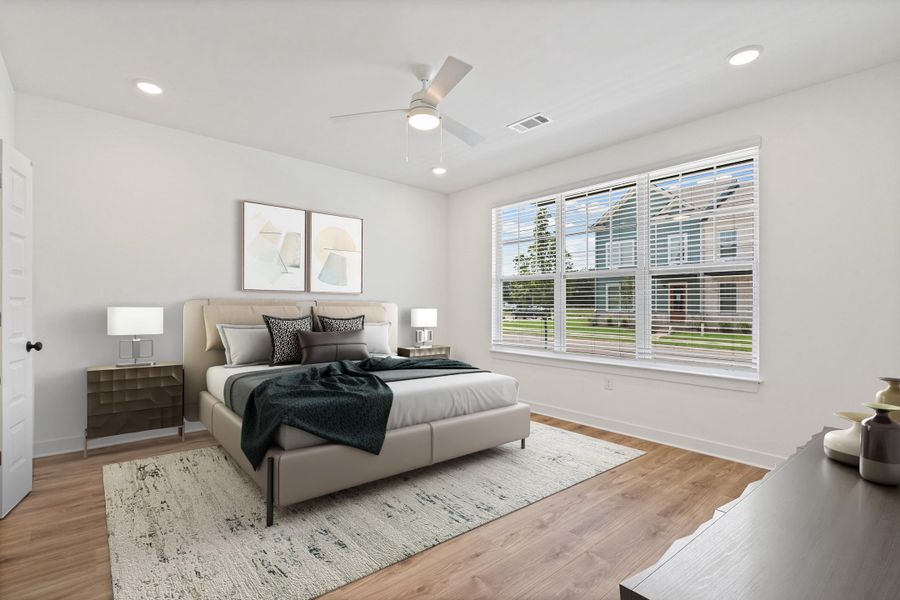 Spacious interior with wood-finish flooring, a large window with white blinds, and recessed lighting