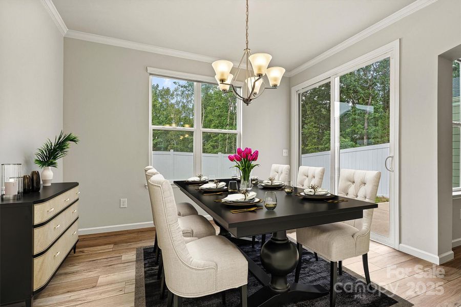 This virtually staged eat-in kitchen showcases a bright and airy space with oversized windows and sliding doors that open to your private backyard—complete with a spacious dining table offering plenty of seating for family meals or casual gatherings This virtually staged eat-in kitchen showcases a bright and airy space with oversized windows and sliding doors that open to your private backyard—complete with a spacious dining table offering plenty of seating for family meals or casual gatherings