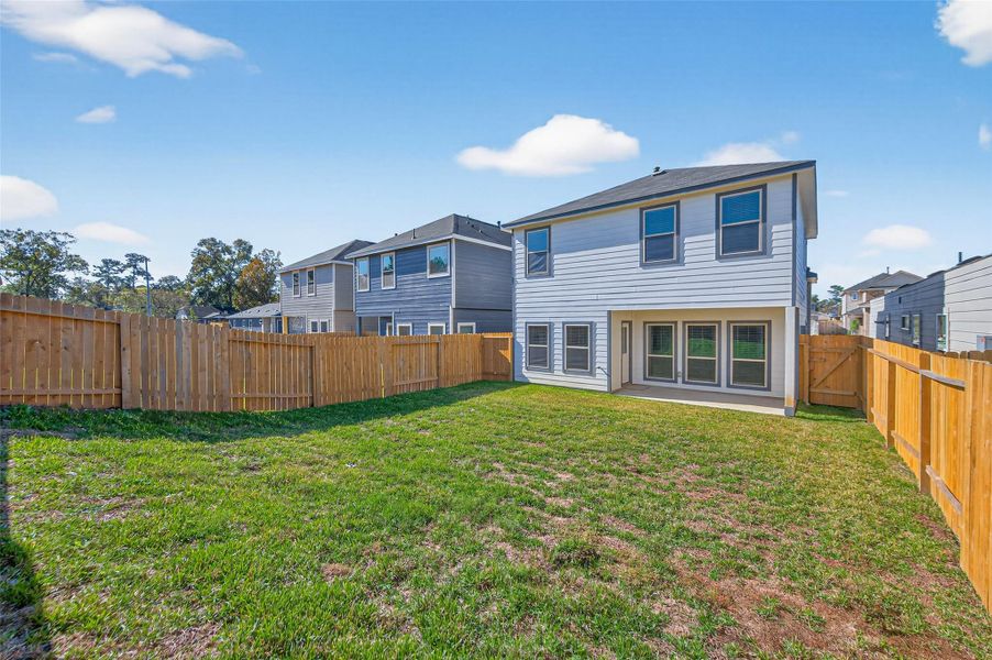 Exterior details and patio area of a home in Woodland Lakes, Huffman (Image 29). Exterior details and patio area of a home in Woodland Lakes, Huffman (Image 29).